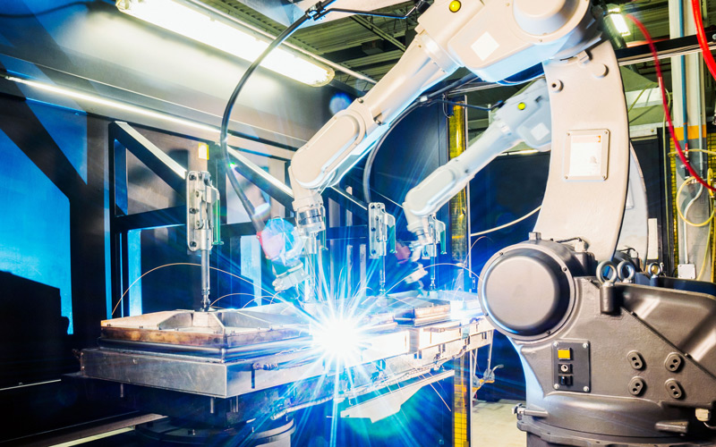 High tech robotic welder in a modern metal factory