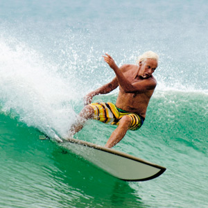 Old man wave surfing