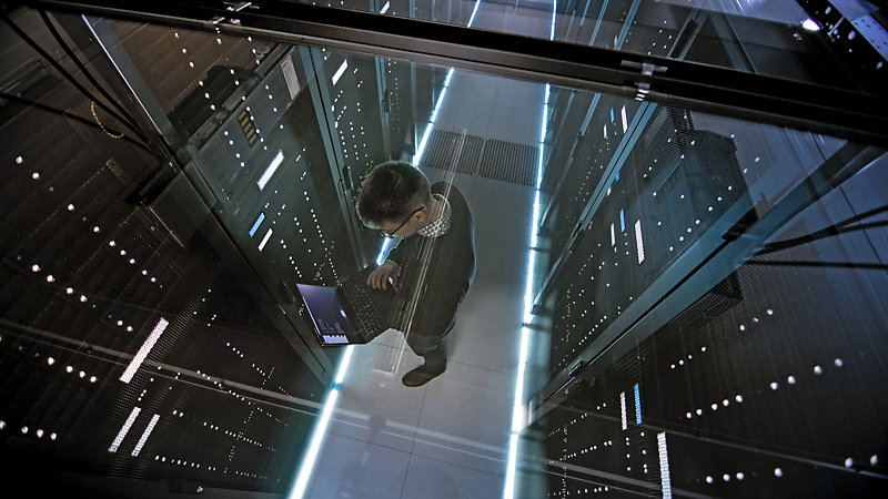 Top view through glass ceiling, of engineer working.