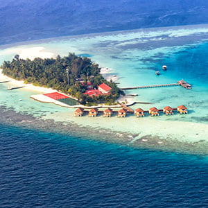 Aerial view of a vacation island resort, in Maayafushi, Maldives.