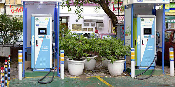 Two electric vehicle charging stations at a parking lot in New Delhi’s Khan Market, India.
